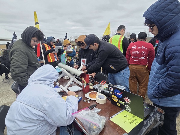 Team prepping rocket for launch 